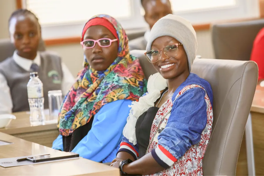 Two young women smiling during a session