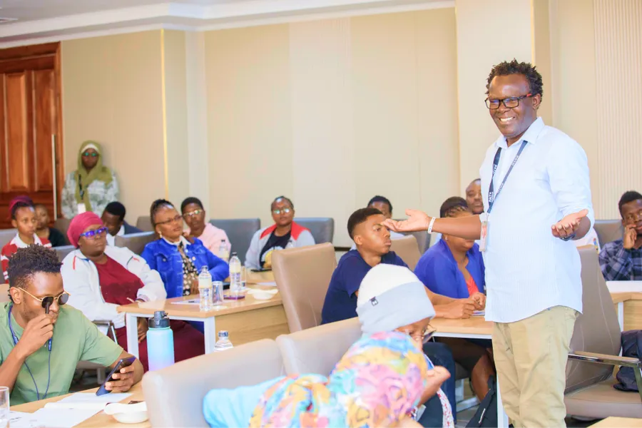 A facilitator standing in a classroom session