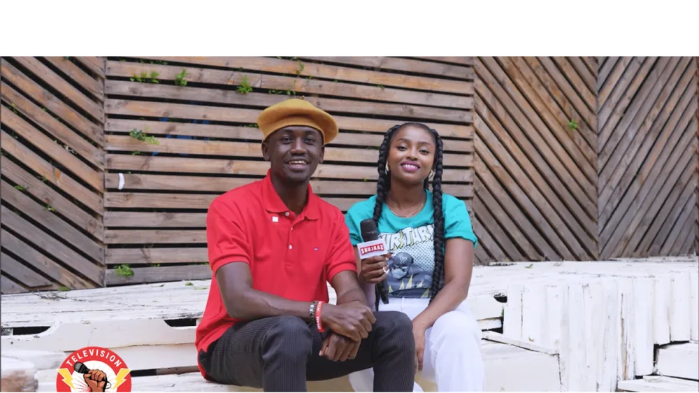 A young man and woman seated together during a Surround Sound Kenya street interview